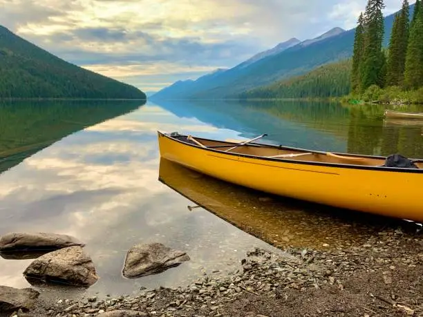 Beautiful calm lake after a long paddle. Canoe resting on the Bowron Lake Circuit, September 2019, Bowron Lake Provincial Park, Canada, BC