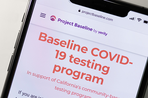 An online and basic COVID-19 testing program Project Baseline homepage is seen on an iPhones screen. Named Project Baseline by Verily, the company is a independent subsidiary of Alphabet Inc.