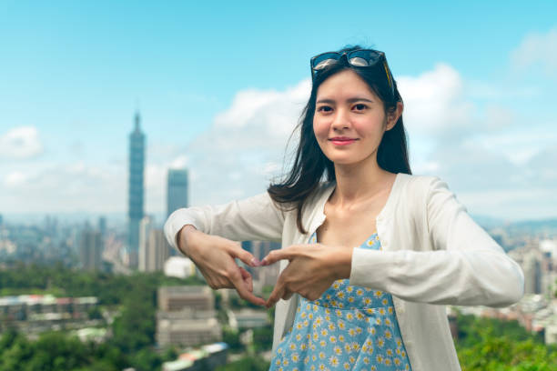 Woman showing love shape to Taiwan During Covid-19 break out