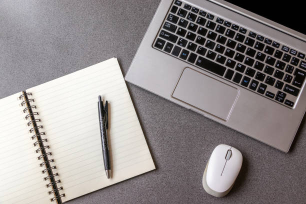istock Laptop and writing utensils on the desk 1323784785