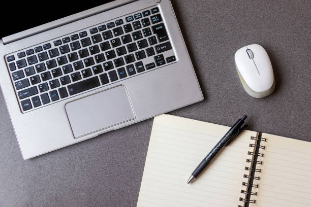 istock Laptop and writing utensils on the desk 1323784791