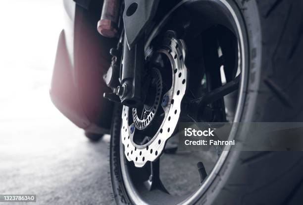 Closeup Disc Brake Of A Scooter Aluminum Alloy Wheel Of Motorcycle Steel Rims Mag Wheels Of Motorbike Performance Wheel And Tire Of Motorcycle Chrome Disc Brake And Abs Motorbike Accessory Stock Photo - Download Image Now