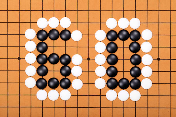 istock chinese game go,  Gobang and go game board 1323787963