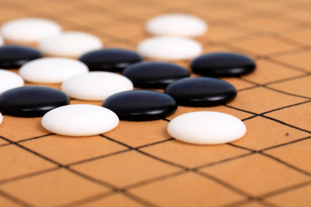 istock chinese game go,  Gobang and go game board 1323787967