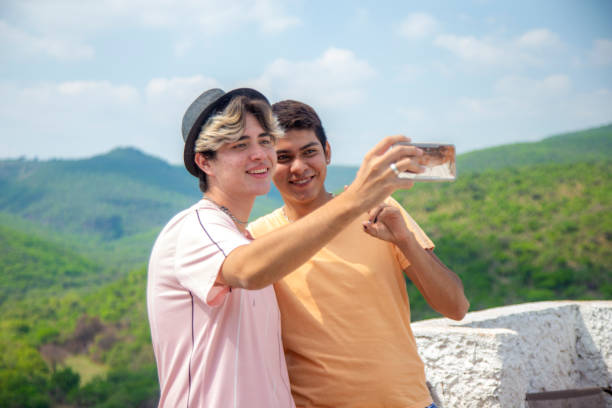 istock Young gay couple, enjoying holidays 1323792066