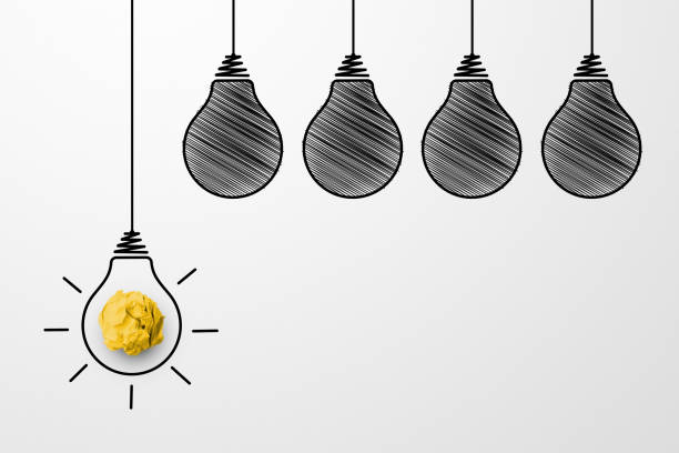 istock Creative thinking ideas and innovation concept. Paper scrap ball yellow colour with light bulb symbol on white background 1323798555