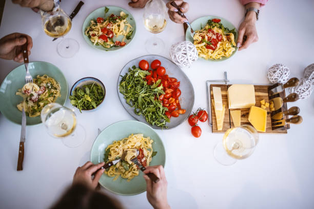 istock Friends enjoying a dinner together 1323799336