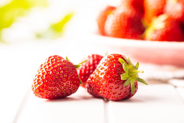 istock Whole ripe red strawberries. 1323799373