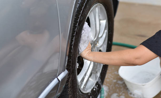 istock Cleaning car alloy wheels 1323803629