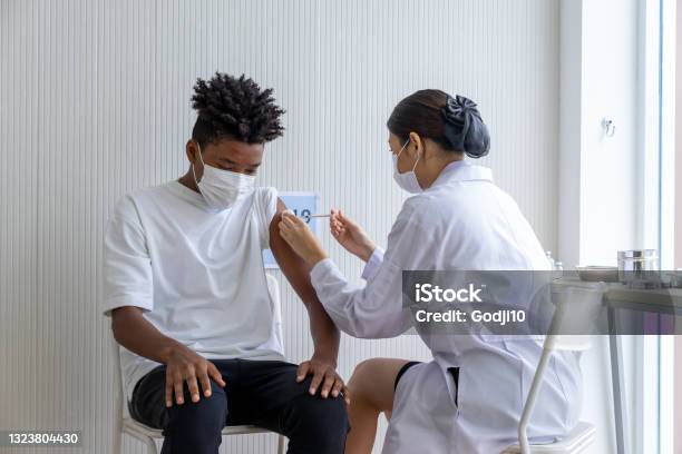 African American People Who Have Received A First Dose Covid19 Antiviral Vaccine At The Vaccination Station Stock Photo - Download Image Now