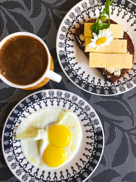 istock a homemade breakfast of scrambled eggs, coffee and a cheese sandwich on a nice plate. 1323805842