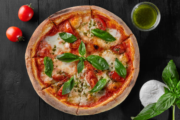 istock Pizza Margherita with tomatoes, mozzarella cheese and basil 1323805883