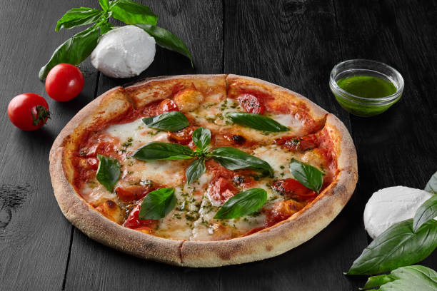 istock Traditional Italian pizza Margherita with tomatoes, mozzarella, basil 1323805905