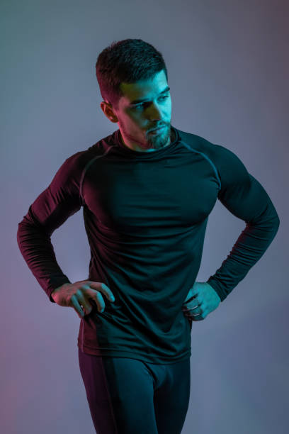 istock Young man in sportswear showing his athletic physical shape 1323807107
