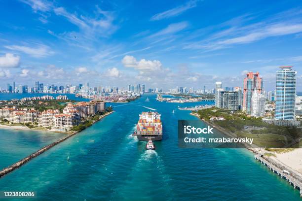Large Container Ship Entering Harbor And Miami City On Sunny Day Usa Aerial View Stock Photo - Download Image Now