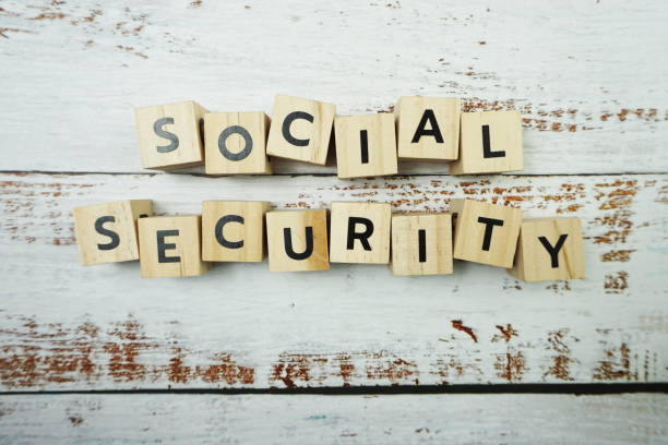 istock Social Security Word alphabet letters on wooden background 1323809361