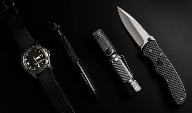 istock Tactical EDC gear on black background (Every Day Carry) 1323812485