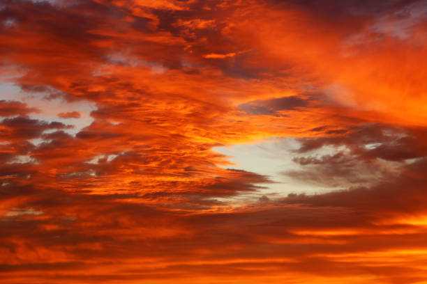 istock Sunset on colorful dramatic sky with red and orange clouds 1323815194