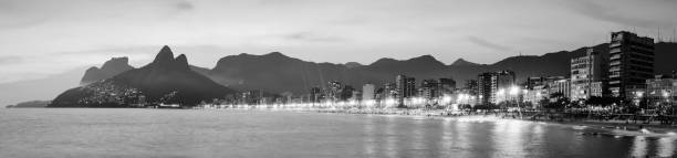 istock The Two Brother Mountain and Ipanema Beach at night 1323816214