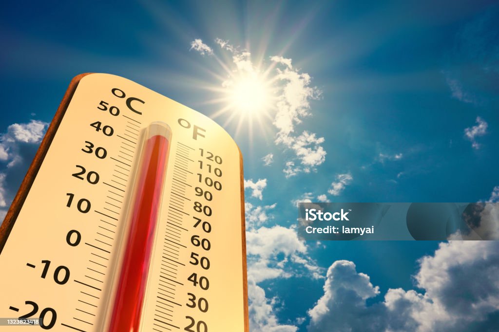 low angle view Thermometer on blue sky with sun shining climate change, low angle view Thermometer on blue sky with sun shining in summer show increase temperature, concept global warming Heat - Temperature Stock Photo