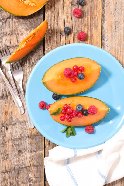 istock melon slice with berries fruits 1323826832