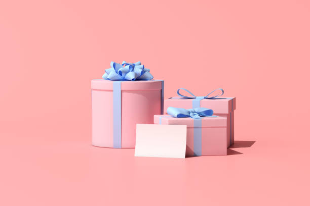 istock 3D rendering of gift box and greeting card on pink background. 1323829717