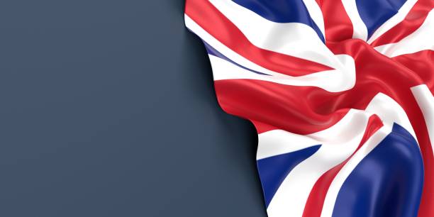 british flag is waving against blue gray surface - british flag imagens e fotografias de stock