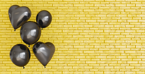 yellow brick background with black heart balloons on one side and space for text. 3d render