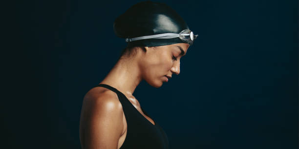 istock Professional female swimmer with goggles and a hat 1323833027