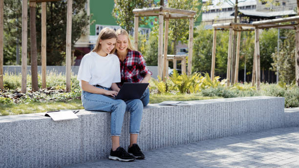 istock Two young high school student girl spending time near campus 1323834055