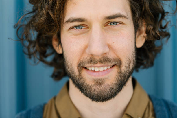 istock Handsome blue-eyed young man smiling at camera 1323834244