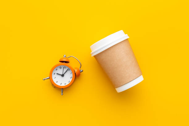 istock Good morning with coffee and alarm clock. Coffee concept 1323839436