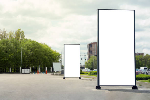istock Blank advertising boards on sidewalk in city. Mockup for design 1323841953