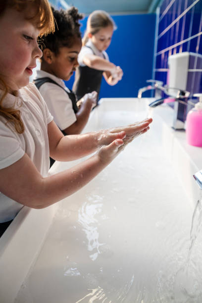 istock School Girls Washing Their Hands 1323841964