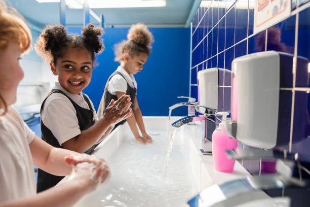 washing hands at school - washing hands imagens e fotografias de stock