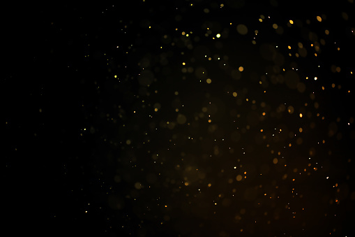 textura de polvo de oro o gotas sobre un fondo negro, superposición photo