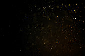 texture of gold dust or drops on a black background, overlay