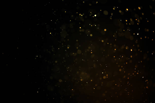текстура золотой пыли или капли на черном фоне, наложение - light effect стоковые фото и изображения