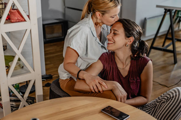istock LGBT Lesbian couple at home 1323845647
