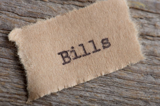 istock Bills typed text on a paper, real estate concept 1323846236