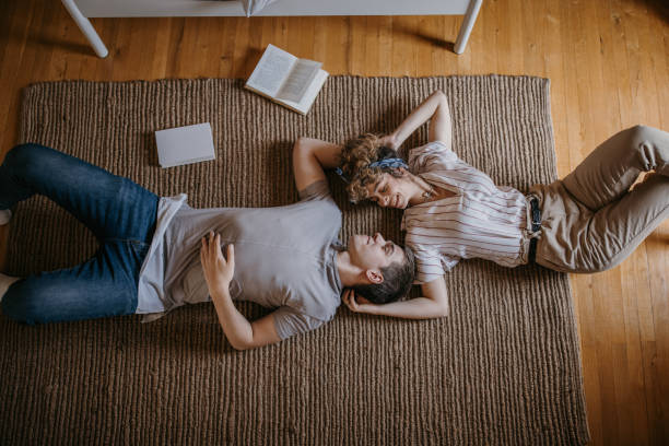istock Couple lying on the floor 1323846368