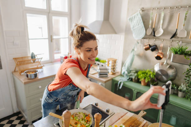 Young woman filming content for her cooking vlog