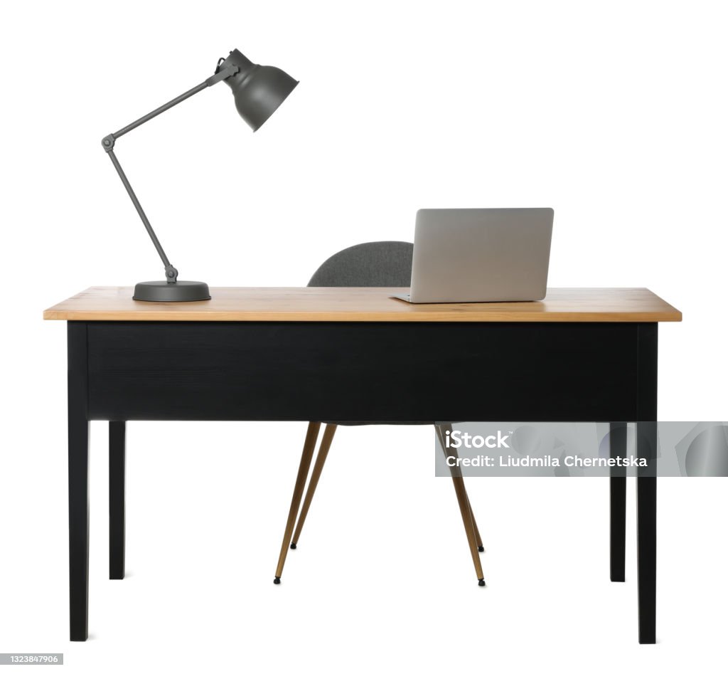 Stylish workplace with wooden desk and comfortable chair on white background Desk Stock Photo