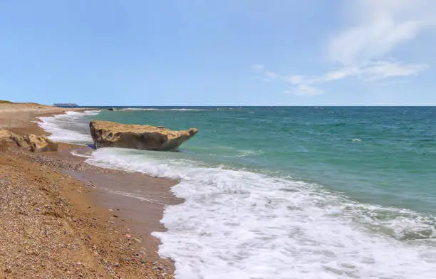 Big stone on the coastline on the lara bay beach. Akamas peninsula, Cyprus.