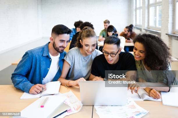 Classmates Are Discussing Together In Classroom Stock Photo - Download Image Now - 20-24 Years, Adult, Adults Only