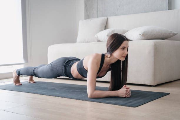 istock Positive woman training her muscles strength and endurance 1323855200