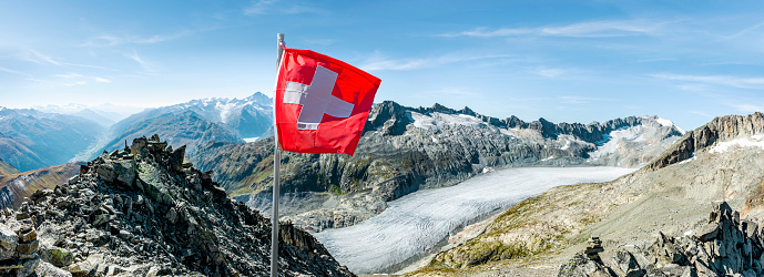Swiss flag in front of rhone glacier
