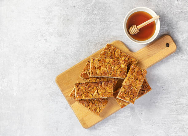 Almond florentines or Bee sting, thin shortbread covered cookies with honey