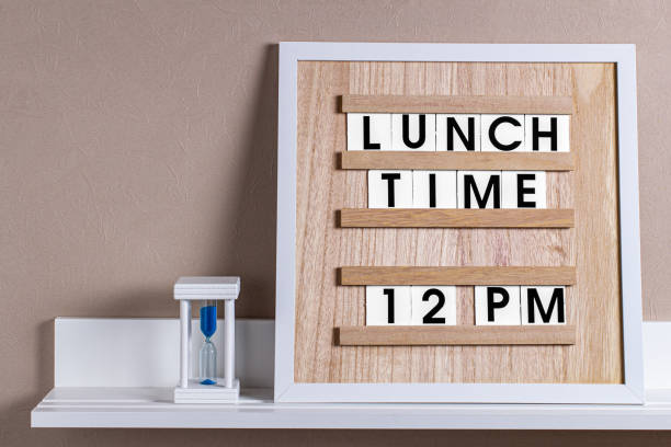 istock a wooden board with the words lunch time inserted. 1323856185