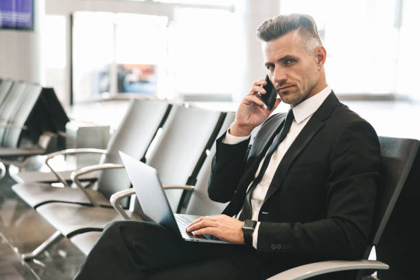 istock Successful mature businessman talking on mobile phone 1323856376